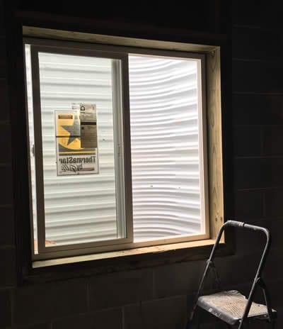 An Egress Window is set up in this home's basement. BDB Waterproofing can help you install one.